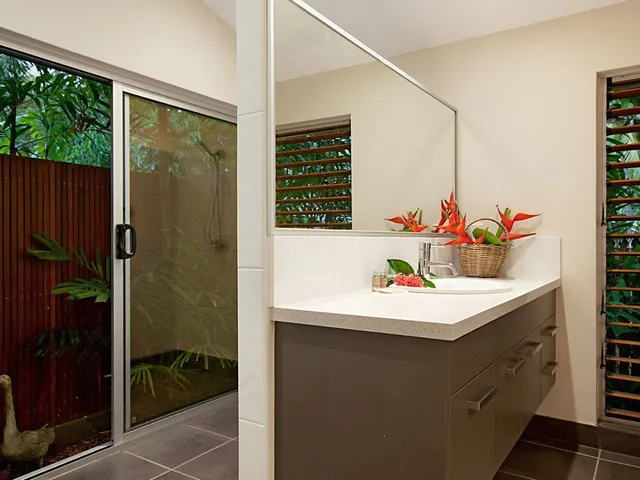 Bathroom with timber louvres and vanity