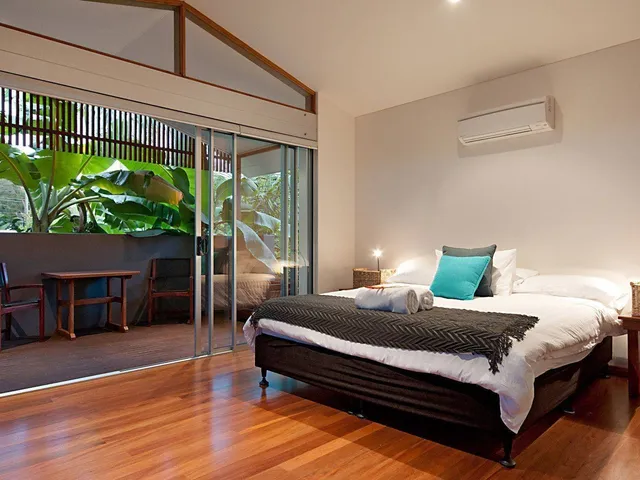Bedroom opening onto a private garden deck
