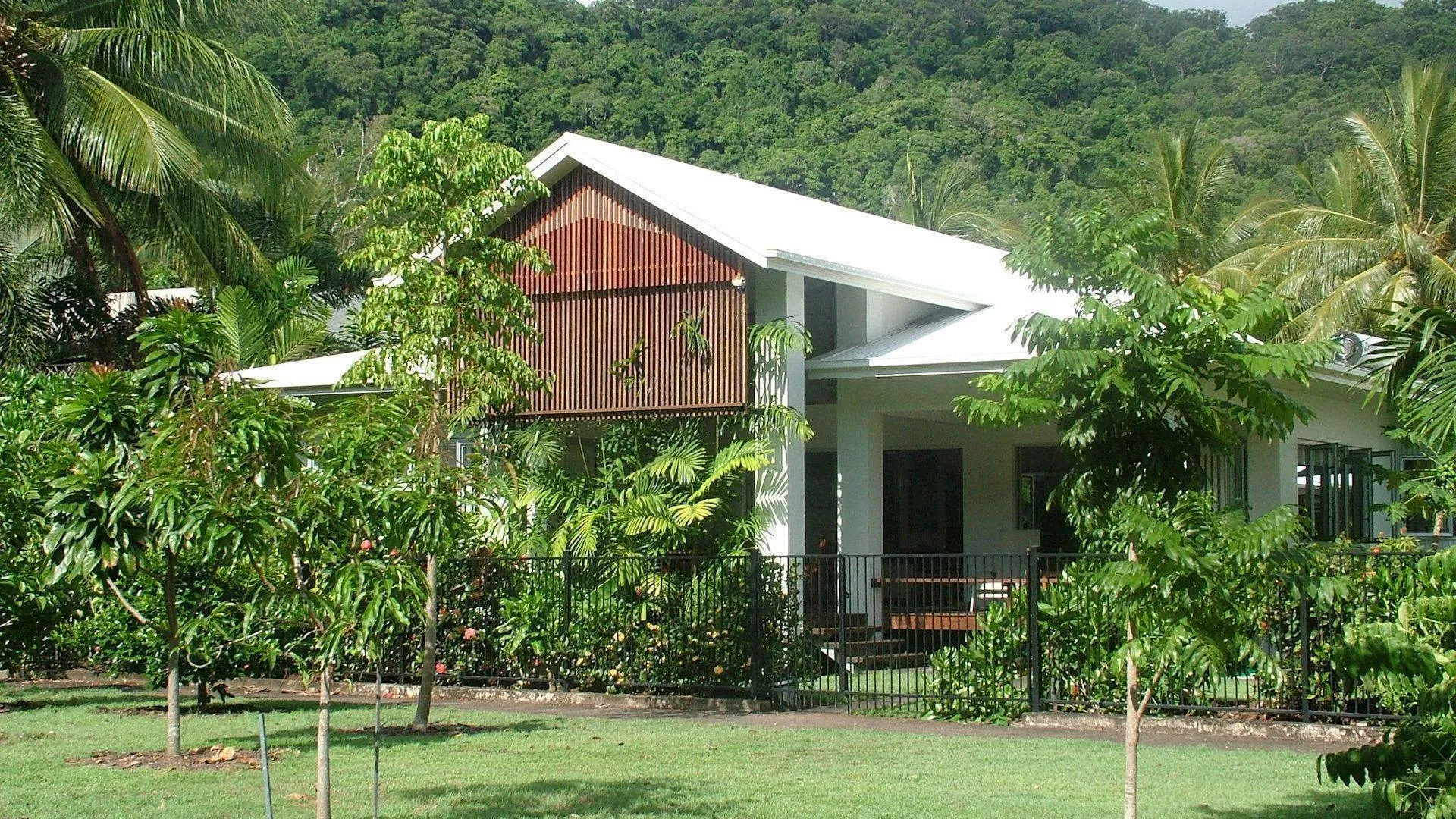 The house set in a lush tropical garden