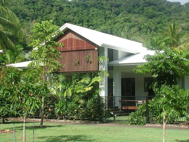The house set in a lush tropical garden