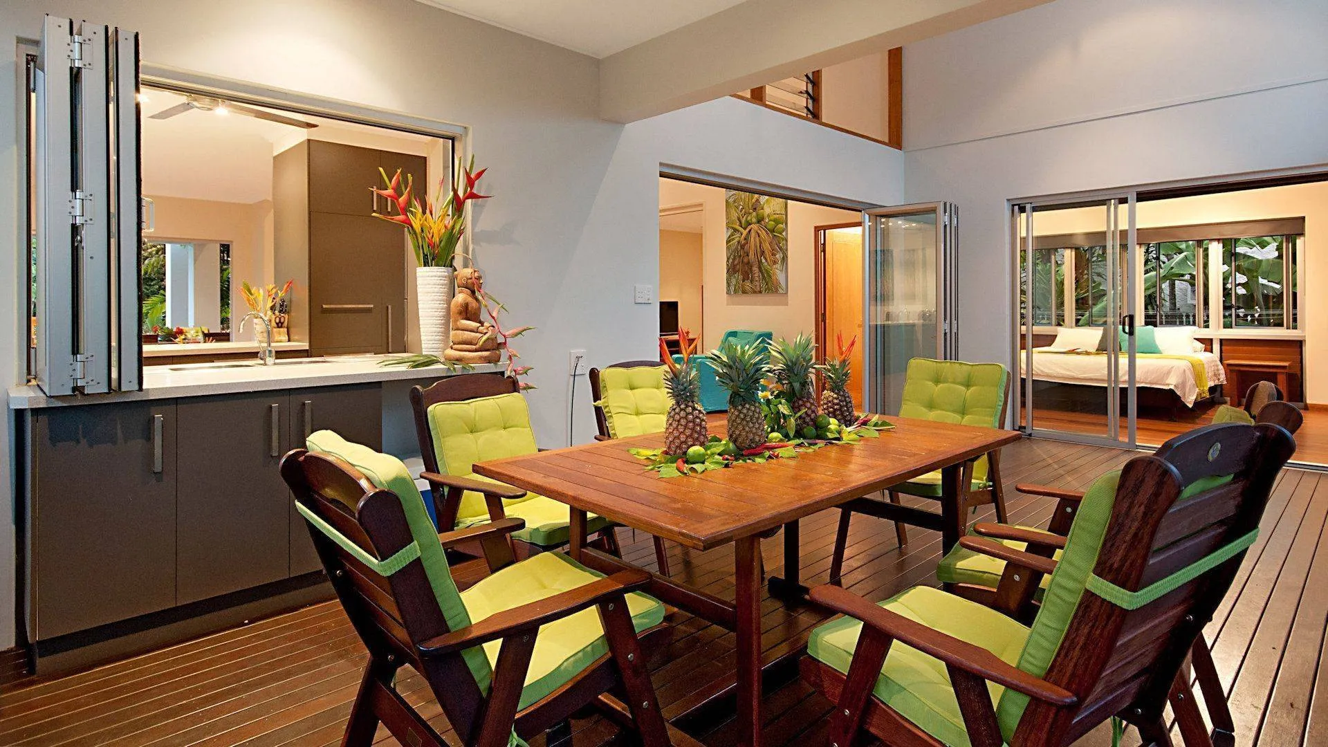 Dining table set with tropical flowers and fruit