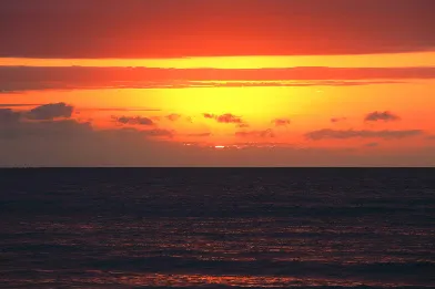 Deep orange sky over the Coral Sea