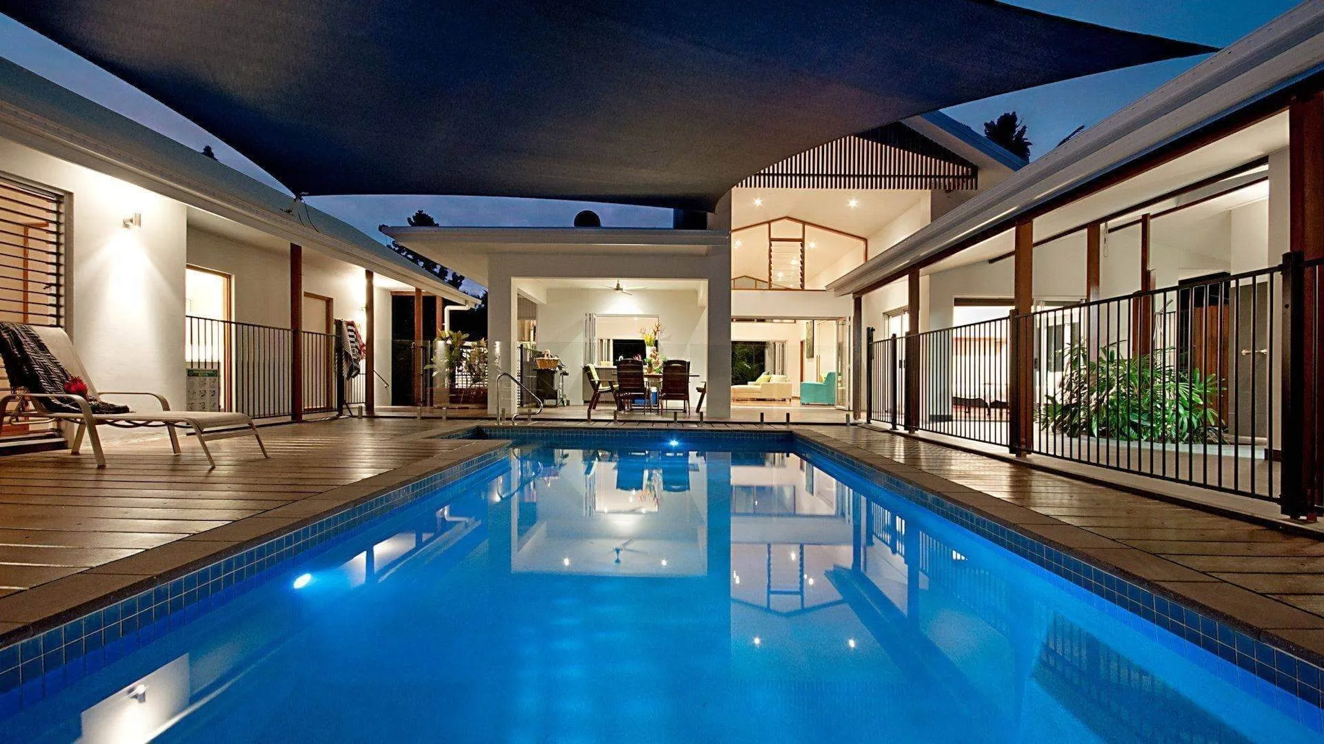 Solar-heated saltwater pool in the courtyard at dusk