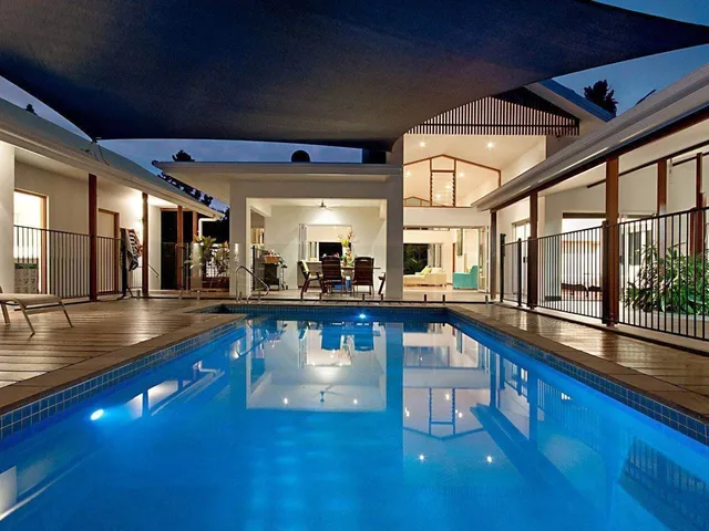 Courtyard pool lit at dusk